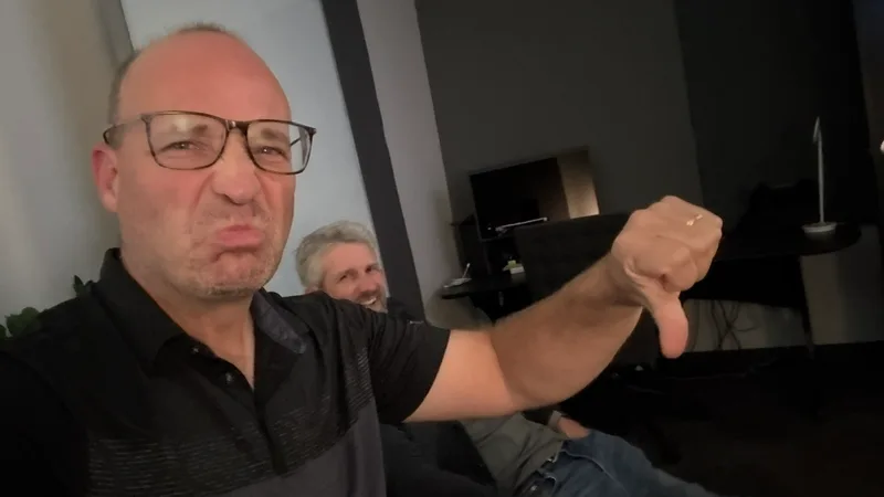 A playful behind-the-scenes moment with collaborators in an edit suite