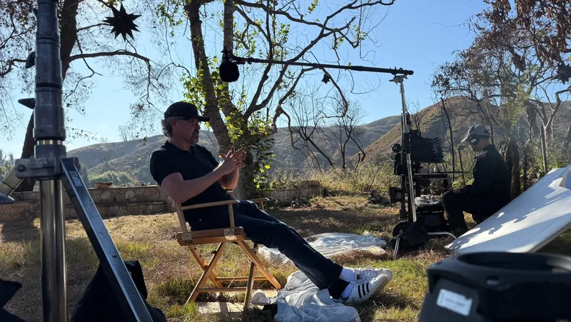 Outdoor interview with a camera, boom microphone and reflector